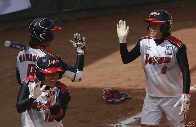 Haruna Sakamoto high fives a teammate after hitting a home run